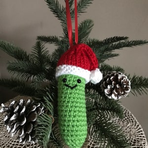 Crocheted Pickle with Santa hat knitted