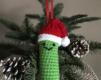 Crocheted Pickle with Santa hat knitted