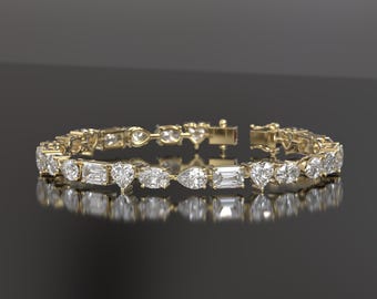 May include: A gold bracelet with a row of clear diamonds of various shapes, including pear, round, and baguette.