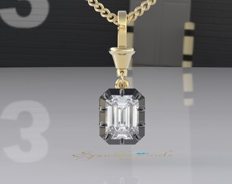 May include: A gold chain necklace with a black and gold pendant featuring a large, clear emerald-cut diamond.