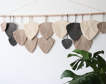 Modern living room wall decor, feathers natural wall hanging over king bed, cream macrame wall hanging