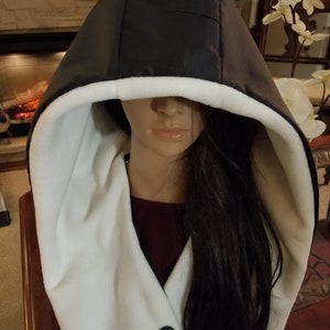 Singing in the Rain in this Updated Rain Hood Waterproof, Over-Sized, Black Exterior/Neutral Color Interiors See Description. Ivory Fleece