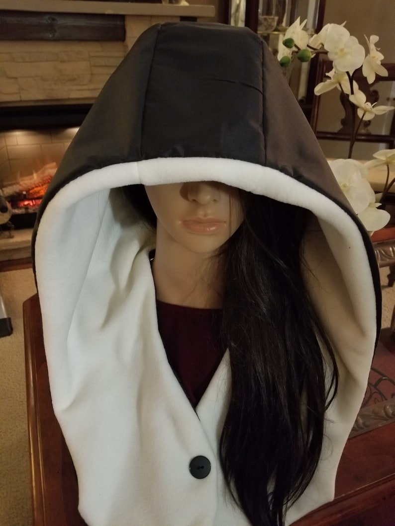 Singing in the Rain in this Updated Rain Hood Waterproof, Over-Sized, Black Exterior/Neutral Color Interiors See Description. Ivory Fleece