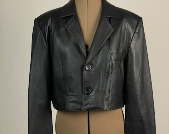 Leather cropped jacket in black color.