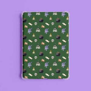 May include: A clear tablet case with a green background and a repeating pattern of Halloween-themed illustrations. The pattern includes cauldrons, castles, skulls, candy, and other spooky elements. The case is designed to fit a tablet.