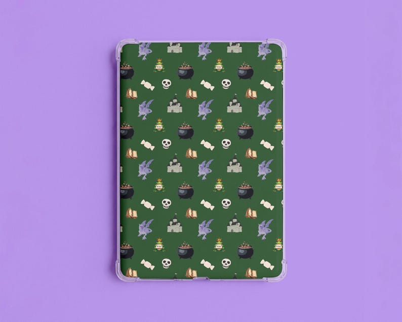May include: A clear tablet case with a green background and a repeating pattern of Halloween-themed illustrations. The pattern includes cauldrons, castles, skulls, candy, and other spooky elements. The case is designed to fit a tablet.