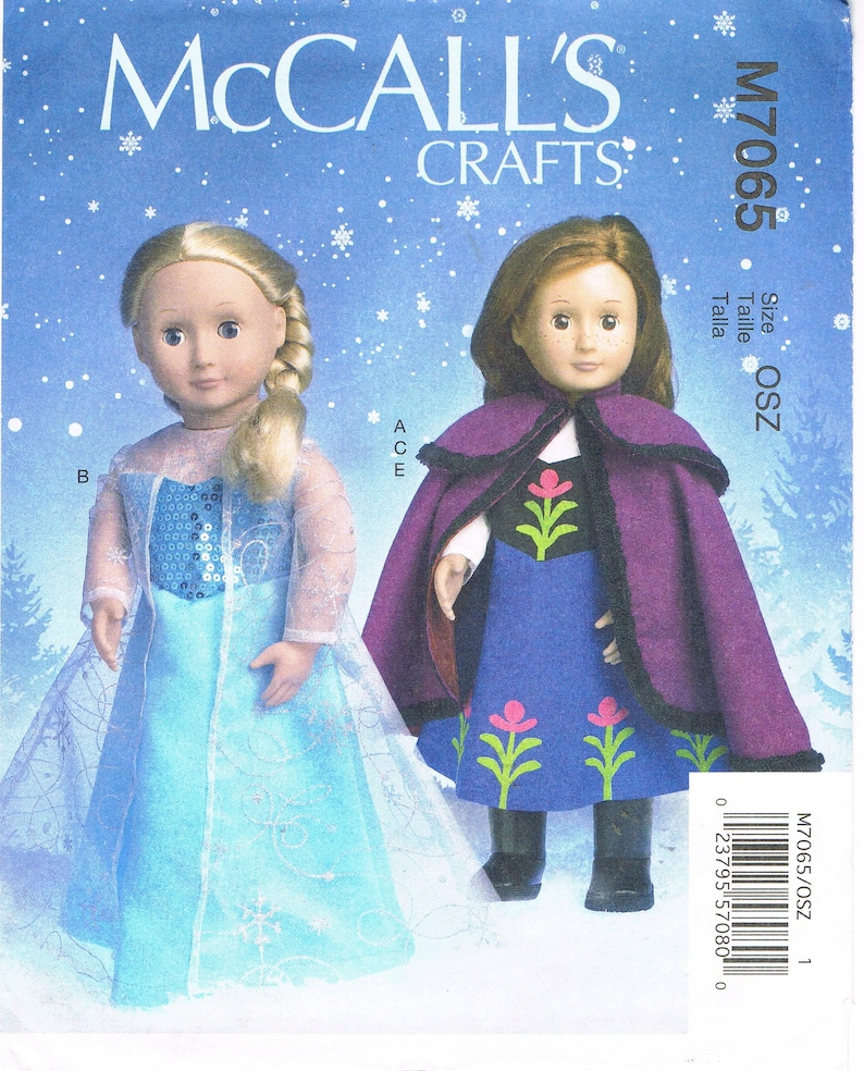 May include: A McCall's Crafts sewing pattern featuring two dolls dressed in costumes. One doll wears a light blue dress with a cape, and the other doll is in a purple cape and blue dress. The pattern number is M7065.