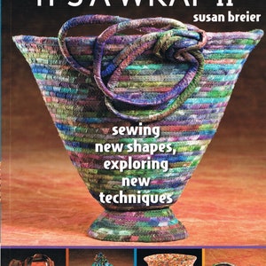 May include: Book cover for "It's a Wrap II" by Susan Breier, featuring a colorful fabric-wrapped basket and the title "sewing new shapes, exploring new techniques".