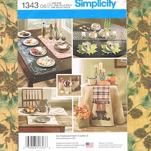 May include: Simplicity pattern 1343, featuring various table setting ideas. The image showcases different table arrangements with decorative elements, including placemats, centerpieces, and fabric designs. The pattern includes the text "U.S. One Size".