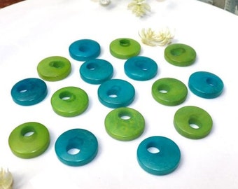 Tagua Beads Donut Shape. Tagua Discs in 2 colors. 16 Tagua Beads. 0.7 in. Height  x 0.7 in. Width. Handmade from Colombia. Jewerly Supplies