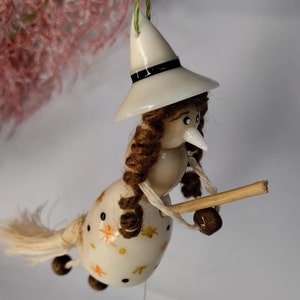 Little witch in tagua. Handmade. Object to decorate.