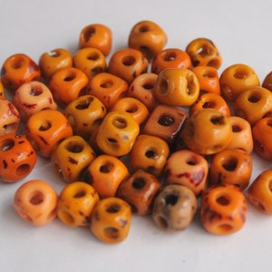 Perline di tagua cubica. 20 pezzi arancioni.