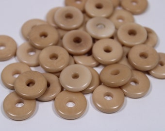 25 discs of tagua discs in beige color. Center drilled. Size: 1.5 cm. approx. Natural Jewelry Making Supplies from Colombia