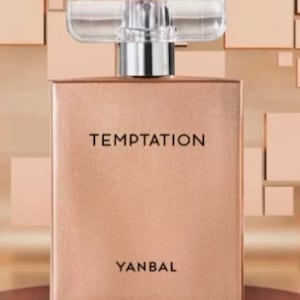 May include: A rectangular perfume bottle with a metallic rose gold finish. The front features the black text TEMPTATION centered near the top and YANBAL at the bottom. It has a clear, wide, rectangular plastic cap with a silver-toned spray nozzle.