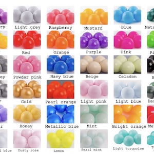 May include: A chart of 42 different colored plastic balls. The balls are arranged in rows and columns, with each row representing a different color. The colors include amaranth, blueberry, light grey, raspberry, mustard, blue, metallic green, green, yellow, red, orange, purple, pink, pistachio, turquoise, white, dark grey, powder pink, navy blue, beige, celadon, black, white pearl, transparent, silver, gold, pearl orange, light pink, light blue, dark green, dark turquoise, dark navy blue, lavender, honey, metallic blue, mint, bright orange, metallic red, bordo, metallic purple, light pearl blue, dusty rose, lemon, pearl mint, light turquoise, turquoise transparent, and amaranth.