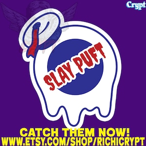 May include: A white sticker with a blue circle and the text "SLAY PUFT" in red. The sticker is shaped like a melting marshmallow with a red and white sailor hat on top. The text "CATCH THEM NOW! WWW.ETSY.COM/SHOP/RICHICRYPT" is below the sticker.