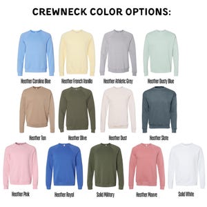 a collection of crew neck sweatshirts in various colors, including blue, yellow, green, gray, and pink.