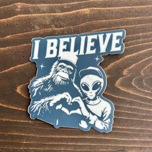 Alien and Bigfoot Sticker | Funny Sasquatch Decal | Yeti Christmas Gift & Holiday Stocking Stuffer | Bigfoot Lover Gift | Believe in Aliens