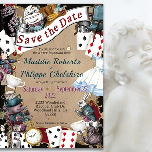 May include: Save the Date invitation with a whimsical Alice in Wonderland theme. The invitation features illustrations of characters like the Cheshire Cat, the Mad Hatter, and the White Rabbit. The text reads "Save the Date" and includes the names Maddie Roberts and Philippe Chelshire, the wedding date, and the location.
