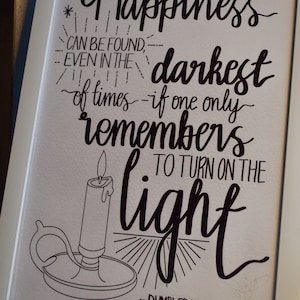 May include: Black and white illustration of a lit candle with the quote "Happiness can be found even in the darkest of times - if one only remembers to turn on the light - Dumbledore"