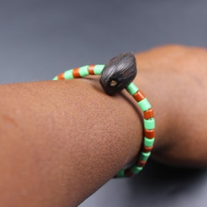 Ileke/Ide Ifa Orunmila Bracelet with Ikin | Green and Brown Yoruba Beads with Palm Nut