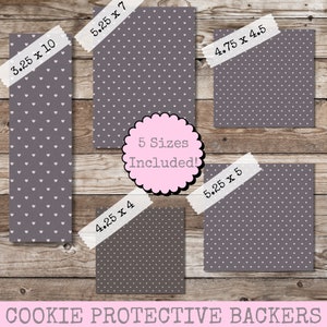 May include: Five different sizes of cookie protective backers with a white heart pattern on a gray background. The sizes are 3.25 x 10 inches, 4.25 x 4 inches, 5.25 x 7 inches, 5.25 x 5 inches, and 4.75 x 4.5 inches.