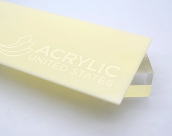 May include: A close-up of a pale yellow acrylic sheet with the text "ACRYLIC UNITED STATES" printed on it.