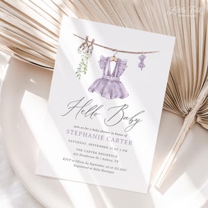 May include: A baby shower invitation with watercolor illustrations of baby clothes hanging on a clothesline. The invitation reads "Hello Baby" and includes event details for Stephanie Carter's baby shower.
