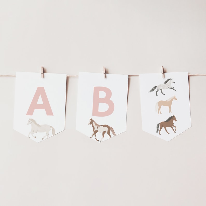 May include: A pink and white banner with the letters A and B, each with a horse illustration. The horses are white, brown, and tan.