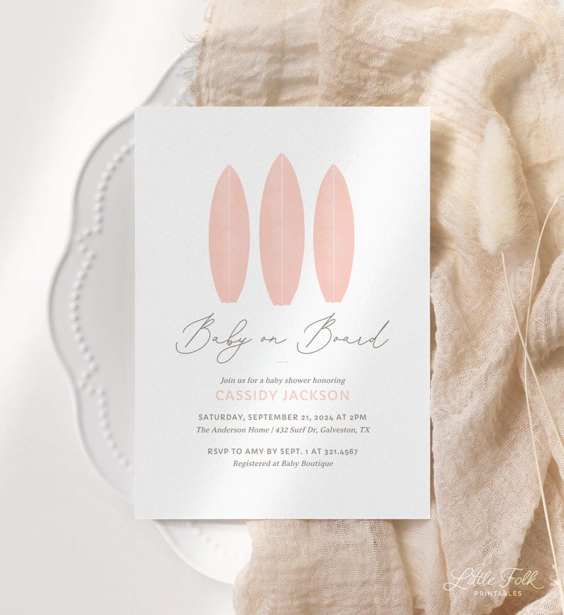May include: A baby shower invitation with a pink and white color scheme. The invitation features three pink surfboards and the text "Baby on Board". The invitation also includes the text "Join us for a baby shower honoring Cassidy Jackson" and the date and time of the shower.