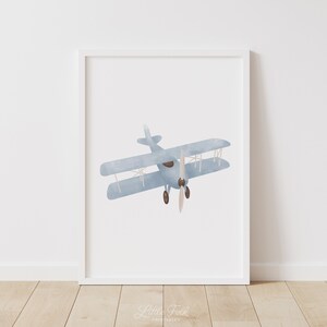 May include: A watercolor illustration of a blue biplane with brown propeller blades against a white background.