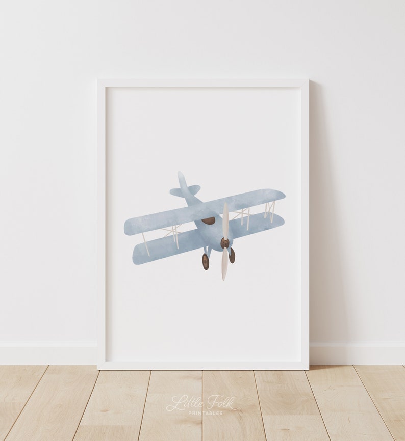 May include: A watercolor illustration of a blue biplane with brown propeller blades against a white background.