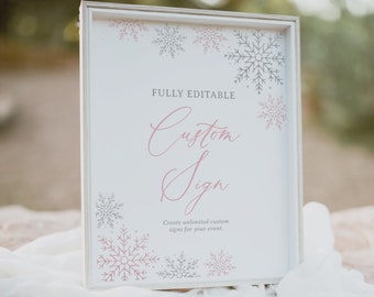 May include: A white sign with a wood frame and a pink and grey snowflake design. The sign says "FULLY EDITABLE Custom Sign Create unlimited custom signs for your event."
