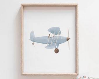 May include: A watercolor illustration of a light blue airplane with brown propeller and wheels. The airplane is framed in a light wood frame.