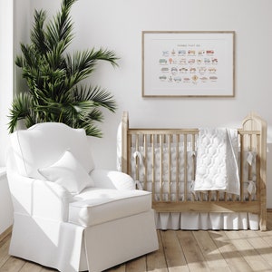 May include: A white cot with a white quilted blanket and a white armchair in a nursery with a framed print that says "Things That Go" with illustrations of various vehicles.