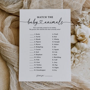 May include: A printable baby shower game with the title "Match the Baby Animals". The game asks players to match 15 baby animals with their mothers. The animals include a koala, turtle, skunk, pigeon, hyena, hedgehog, coyote, seal, elephant, zebra, fish, goat, turkey, baboon, and grasshopper. The mothers include a poult, kid, whelp, nymph, infant, kit, squab, cub, foal, hatchling, calf, joey, pup, piglet, and fry.