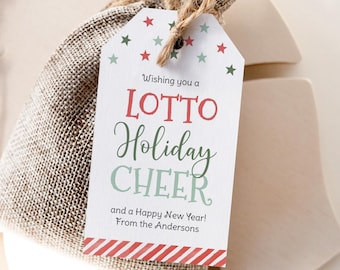May include: A gift tag with the words "LOTTO Holiday CHEER" in red and green, with star accents. The tag is attached to a burlap bag tied with twine. The tag also says "and a Happy New Year! From the Andersons."