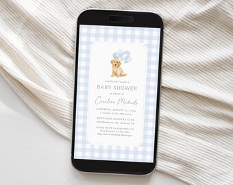 May include: A smartphone displays a baby shower invitation. The invitation features a light blue gingham pattern background and a central design with a golden retriever puppy holding balloons. Text includes "BABY SHOWER" and event details.