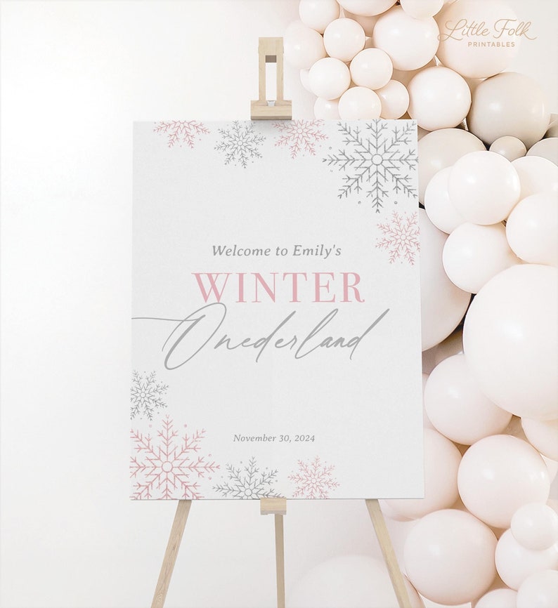 May include: A white welcome sign with pink and grey snowflakes. The sign reads "Welcome to Emily's Winter Wonderland" and "November 30, 2024".