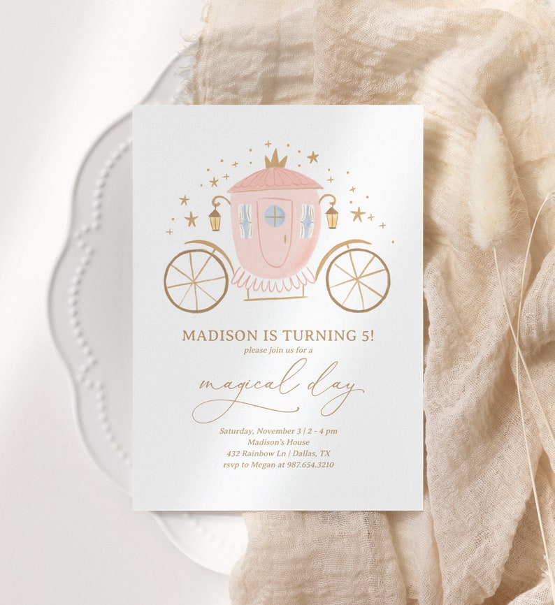 May include: A pink and gold carriage with stars and a crown on top. The text reads "MADISON IS TURNING 5! please join us for a magical day. Saturday, November 3/2-4 pm Madison's House 432 Rainbow Ln | Dallas, TX rsvp to Megan at 987.654.3210"