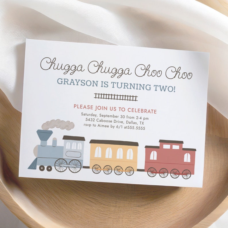 May include: A birthday invitation with a train illustration. The text reads "Chugga Chugga Choo Choo" and "Grayson is turning two!" Additional text includes party details: date, time, location, and RSVP information.
