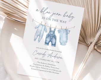 May include: Baby shower invitation with the text "a blue jean baby is on the way." The invitation features watercolor illustrations of baby clothes hanging on a clothesline. The invitation is for Cassidy Anderson.
