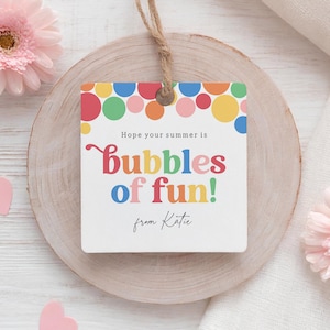 May include: A white gift tag with colorful polka dots and the text "Hope your summer is bubbles of fun! from Katie".