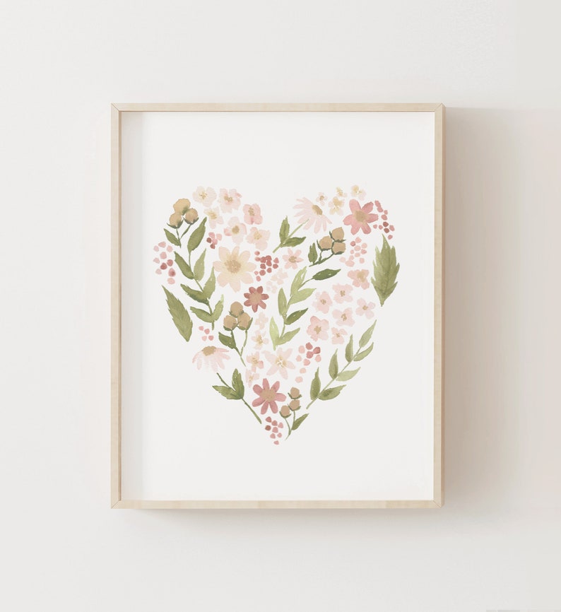 May include: A framed watercolor painting of a heart shape made of pink, white, and green flowers. The flowers are arranged in a heart shape and are surrounded by green leaves.