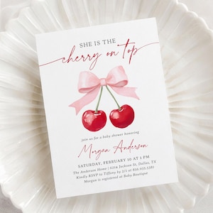 May include: A baby shower invitation featuring the phrase "She is the cherry on top" in red script. The design includes a watercolor illustration of two cherries with a pink bow. The invitation also includes event details.