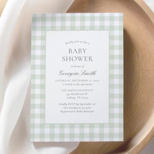 May include: A green and white gingham baby shower invitation with the text "kindly join us for a BABY SHOWER in honor of Georgia Smith" and details for the event.