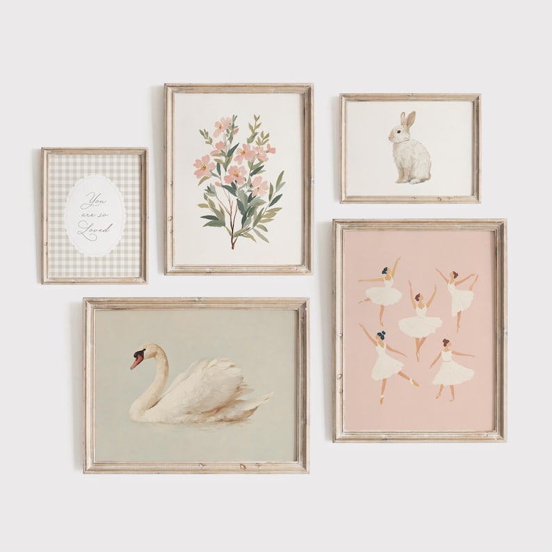 May include: A collection of framed art prints featuring a swan, a bunny, ballet dancers, and floral arrangements. The prints have a neutral color palette with soft pink and green accents, and are displayed against a white background.