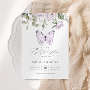 May include: A baby shower invitation with a watercolor butterfly design. The invitation is for Michaela Reynolds and is set for August 30th, 2024 at the Rose Tea Room. The text reads "A Little Butterfly is on the Way".