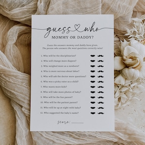 May include: A printable baby shower game with the title "Guess Who? Mommy or Daddy?"  The game has 12 questions about the parents' behaviours and preferences. Each question has a row of black moustaches to mark the answer.
