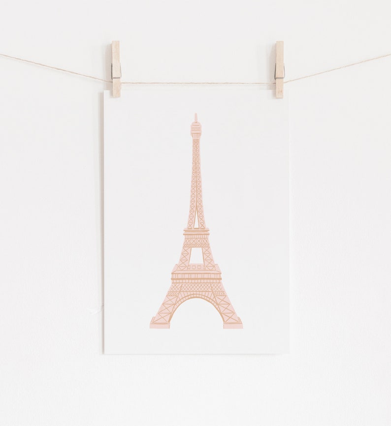 May include: A pink and brown illustration of the Eiffel Tower on a white background.